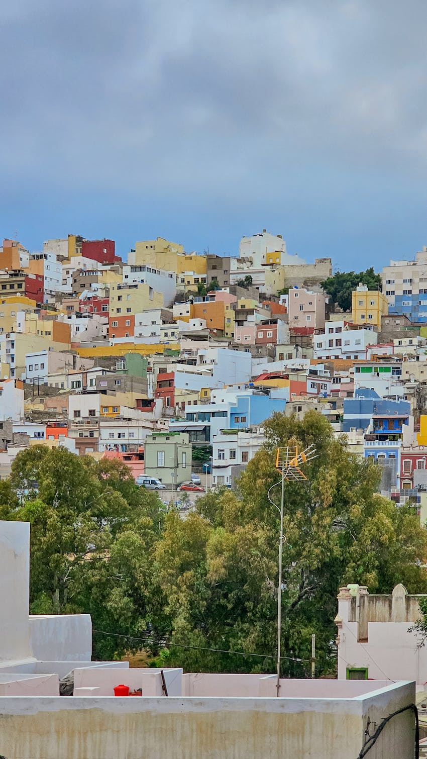 Scenic view of colorful houses on a hillside in Las Palmas, Spain.